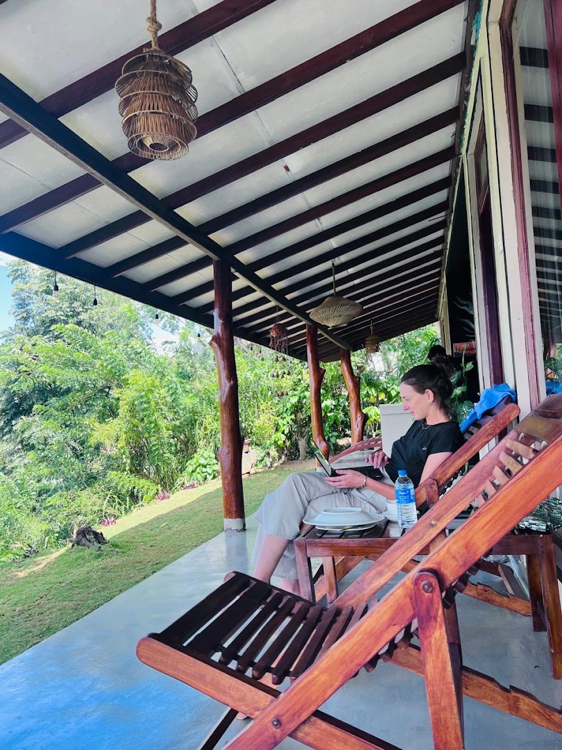 Wooden chairs along the covered garden veranda